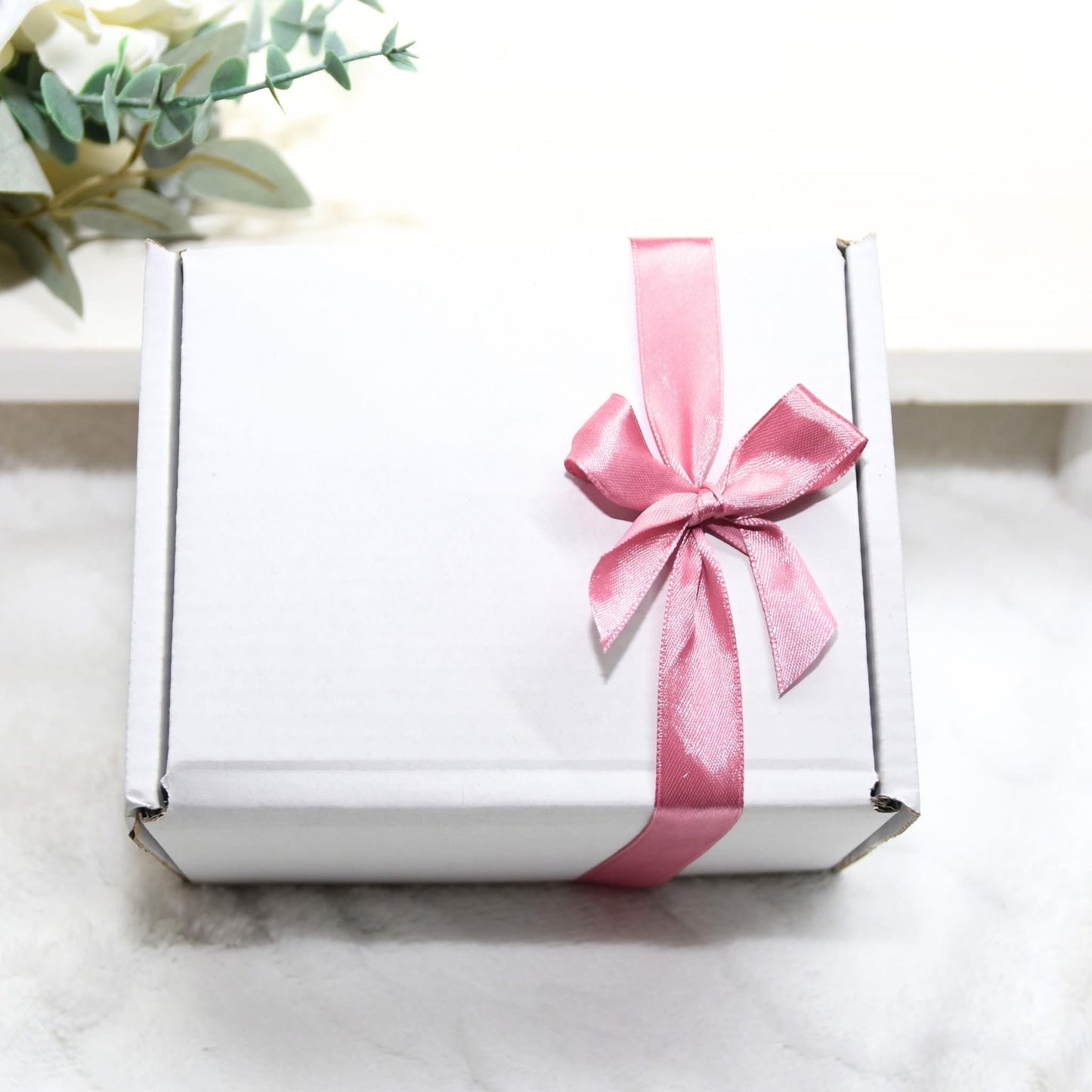 Candle with gift box and matches.